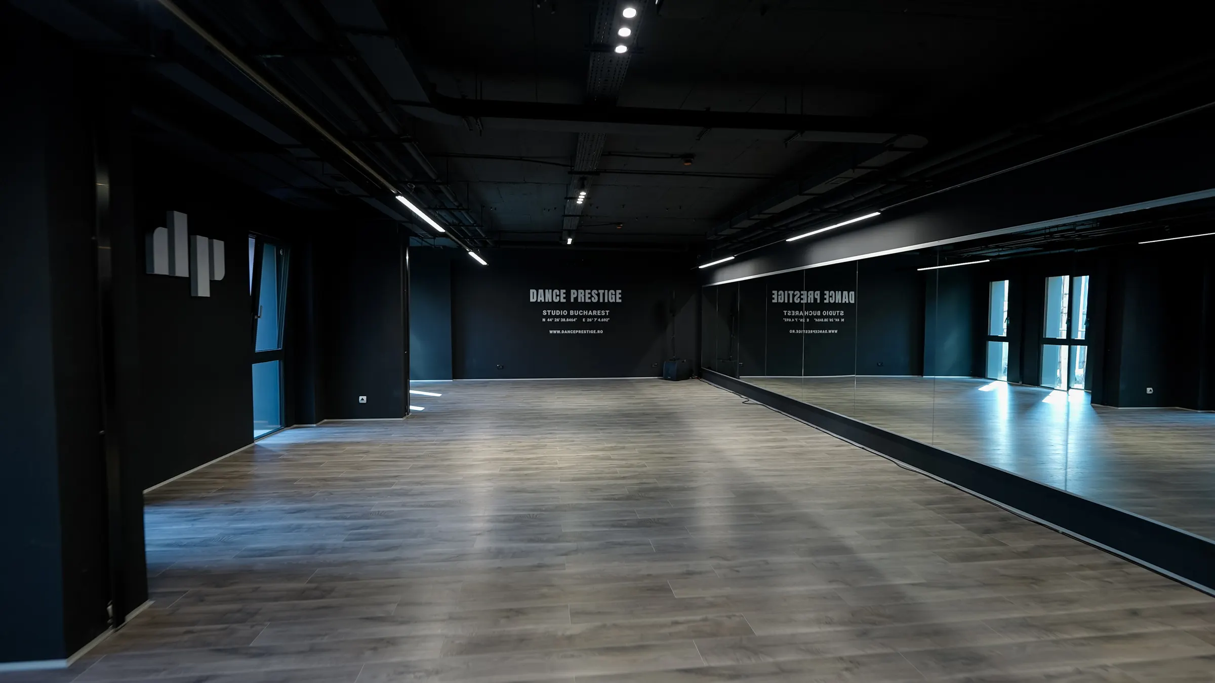 The main Dance Prestige studio: a wall of mirrors and light wood floor